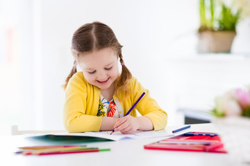 Wall Mural - Little girl painting and writing