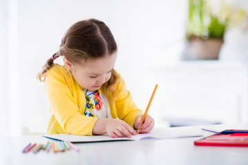 Wall Mural - Little girl painting and writing