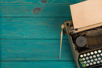 Fototapete - typewriter on the blue wooden desk