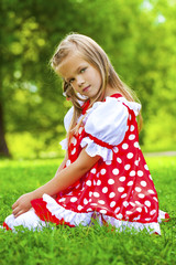 Wall Mural - Portrait of a charming little girl looking at camera