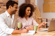 © georgerudy - Attractive Afro-American couple working