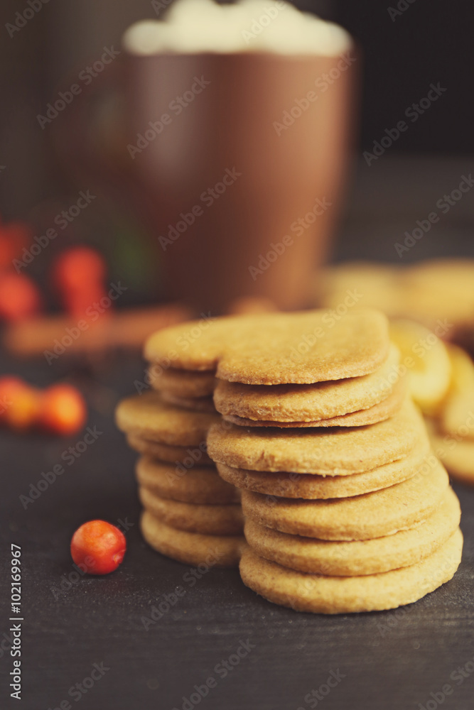 Heart shaped biscuits with marshmallow and sweet spaces on a table