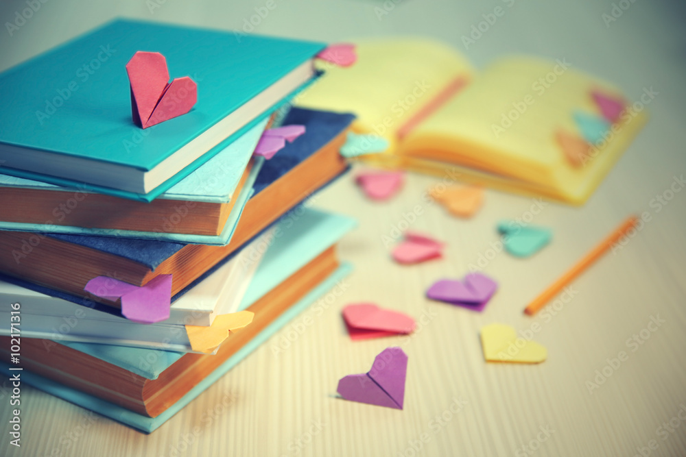 Heart bookmarks for books on wooden table closeup