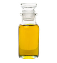 Avocado Fruit Oil Extract In Glass Vial Over White Background