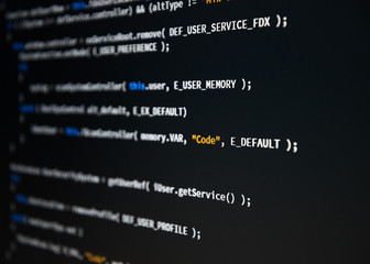 software developer programming code. abstract computer script code. shallow depth of field, selectiv