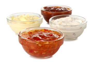 Assorted sauces in a bowl isolated on white background