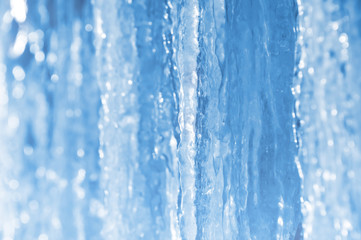 Wall Mural - Bright spring background with icicles in the sunlight