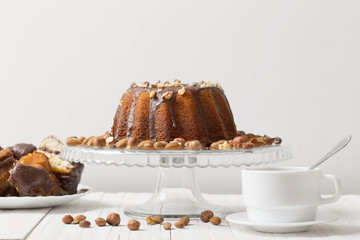 cup of coffee and cake on  wooden table