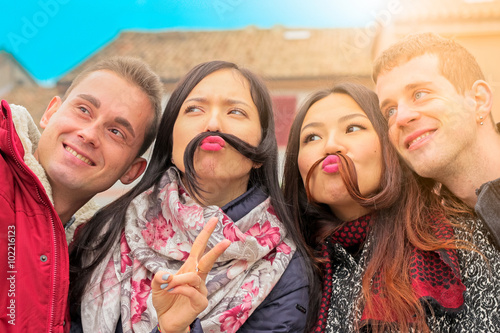 Close Up Portrait Of Girls And Boys Best Friends With Funny Faces On Camera Make Mustache Close Up Portrait Of Girls And Boys Best Friends With Funny Faces On Camera Make Mustache