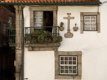 Historical Windows. A Series Of Stone Framed Windows Covered In Crocheted Curtains Is Very Typical Of Portugal. 