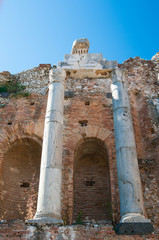  Bottom view of some columns and the arcade in the scene of the roman theater in Taormina, Sicily