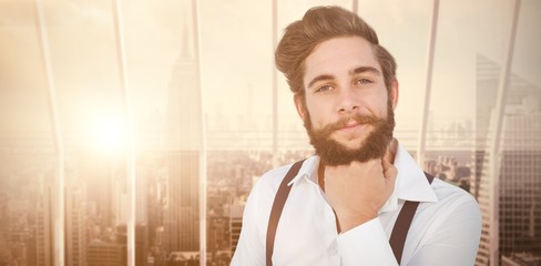 Poster - Composite image of confident hipster with hand on chin