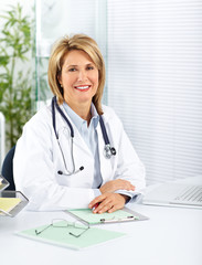 Poster - Mature doctor woman in a clinical office.