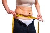 Fototapeta  - Woman measuring fat belly.
