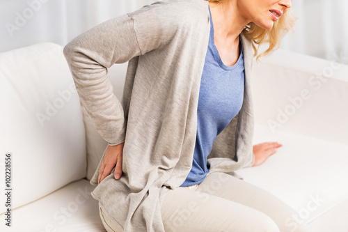Cuadros en Lienzo close up of woman suffering from backache at home