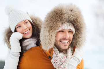 Sticker - happy couple having fun over winter background