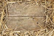 Straw Frame On Rustic Wood