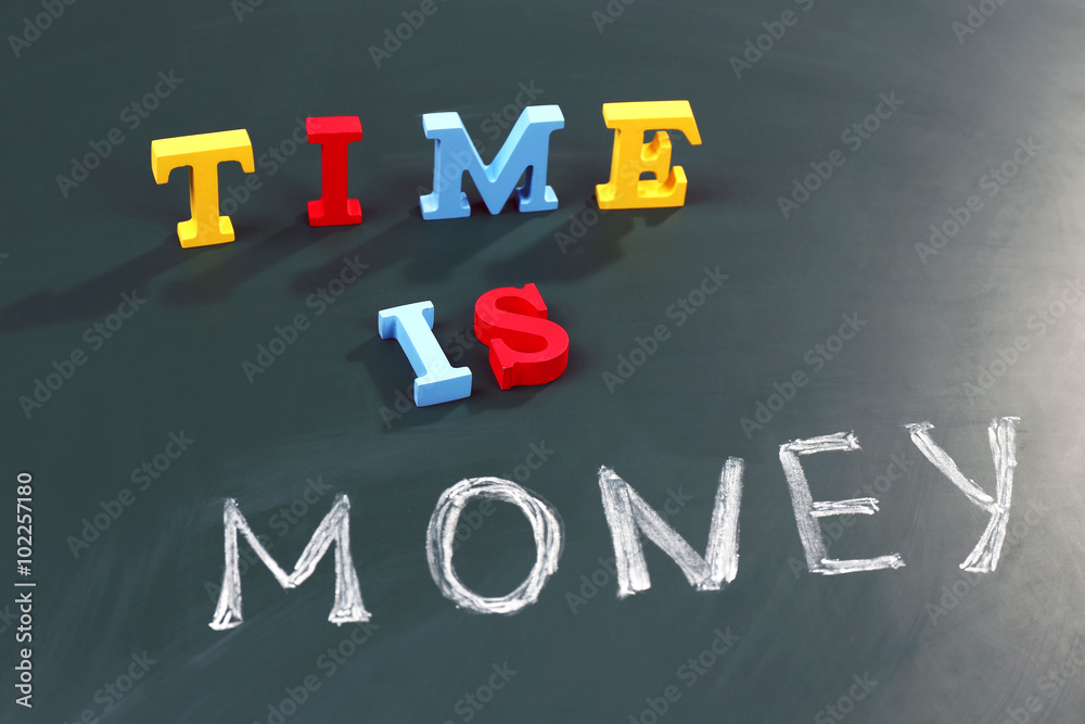 Time is money concept on a blackboard background