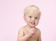 little child baby brushink teeth