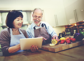 Wall Mural - Husband Wife Cooking Searching Menu Tablet Concept