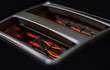 Glowing resistances inside black toaster