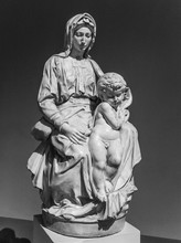 Old Statue Of A Suffering Woman With Child