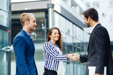 Wall Mural - Business people handshake outdoor