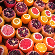 Colorful Image Of Oranges And Pomegranates On The Food Market