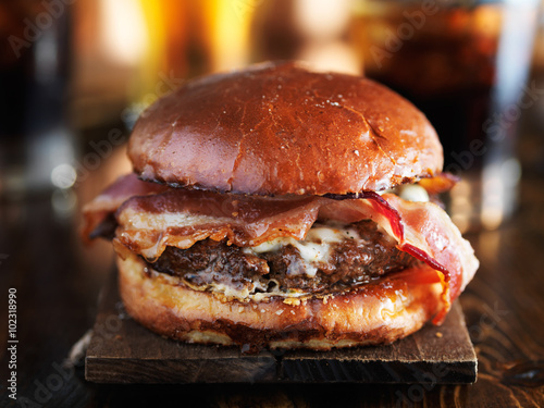 Fotografie, Obraz juicy gourmet cheeseburger with melted pepper jack and strips of crispy bacon