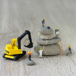 Construction site with miniature workers