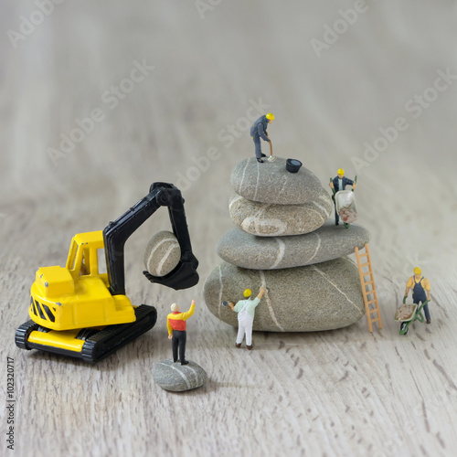 Fotografie, Obraz Construction site with miniature workers