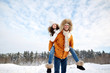 © Syda Productions - happy couple having fun over winter background