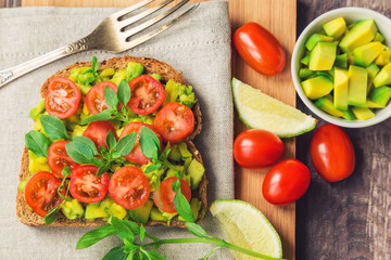 Wall Mural - Toast with avocado, tomatoes and basil