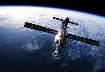 Wall Mural - space station orbiting earth