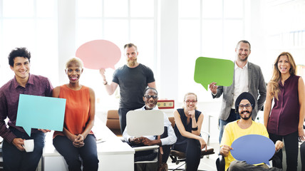 Wall Mural - business team holding speech bubble sign concept