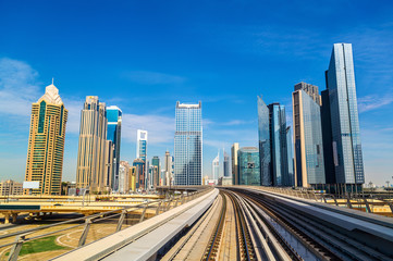 Wall Mural - Skyscrapers and metro in Dubai - UAE