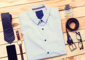 Men's casual clothes on wooden background