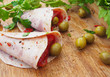 Yummy Italian lunch – mortadella, olives, cheese, marinated bell pepper, herbs