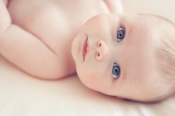 beautiful little baby on a blanket