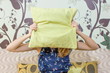 © creativefamily - girl hiding behind a pillow