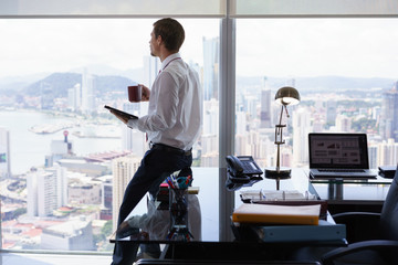 Business Man Reading News Press Review On Tablet PC