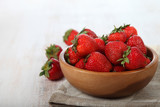 Fototapeta Mapy - Ripe strawberries in a brown bowl