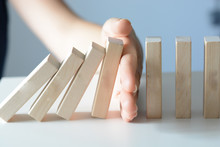 Stopping The Domino Effect Concept With A Business Solution And Intervention