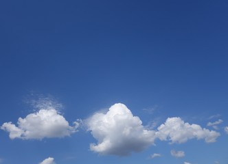 Clouds against clear blue sky background