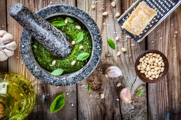 Wall Mural - homemade pesto: basil, parmesan, pine nuts, garlic, olive oil