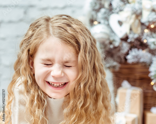 Adorable Blond Little Girl With Long Curly Hair And Closed Eyes