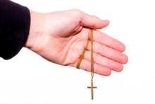 Hand Holds A Chain With Gold Crucifix