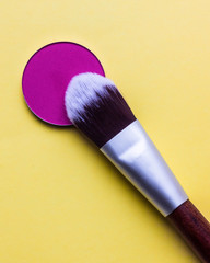 For Make-up. Bright shade with  brush on a yellow background 