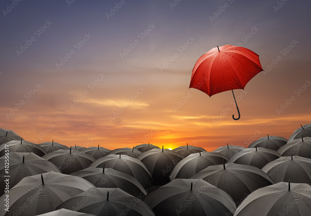 Red umbrella fly out from crowds of black umbrellas - obrazy, fototapety, plakaty 