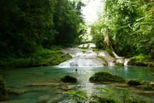 Unidentified Female Tourist Swimming In The Water At Reach Falls Waterfalls Which Are One Of The Most Popular Tourist Destinations And Attractions In Portland Parish, Jamaica.